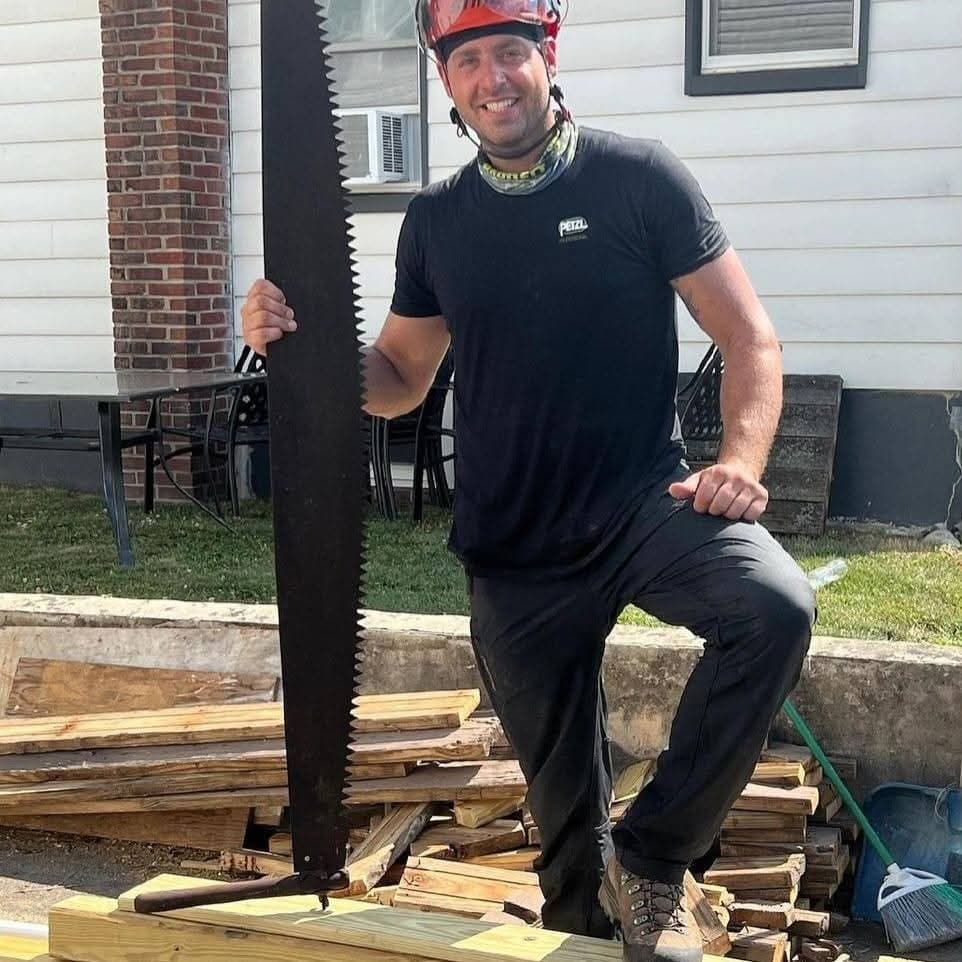 Alan August owner of Alan's Tree Service with crosscut saw in Hunterdon County NJ